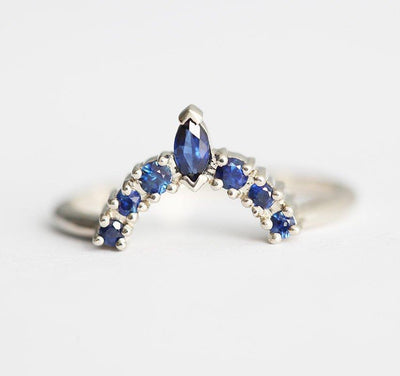 Marquise-cut blue sapphire wedding crown ring with round side sapphires