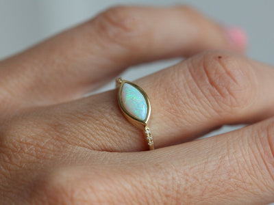 Marquise-Cut White Opal Ring with Accent White Round Diamonds