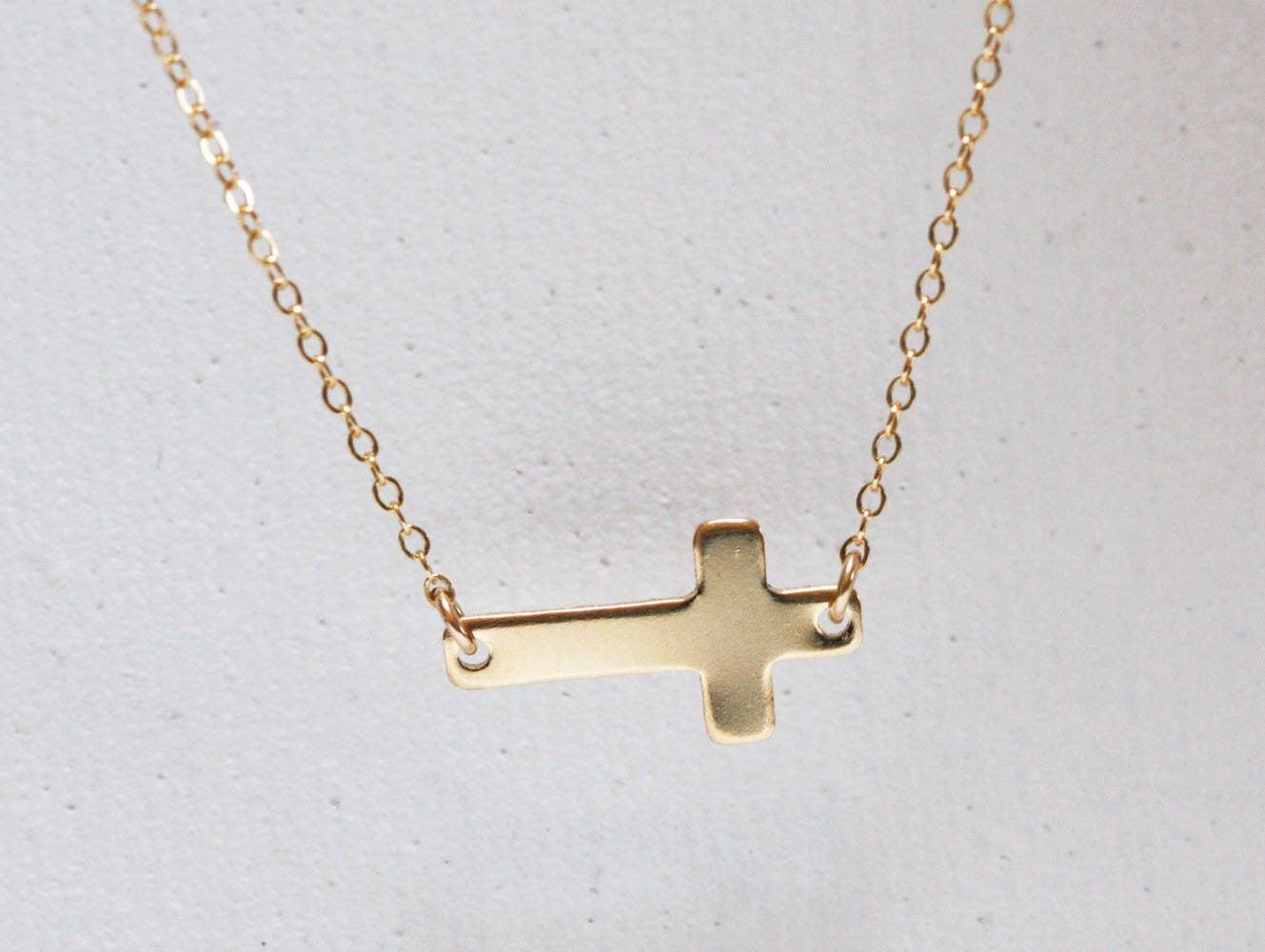 Gold sideways cross necklace