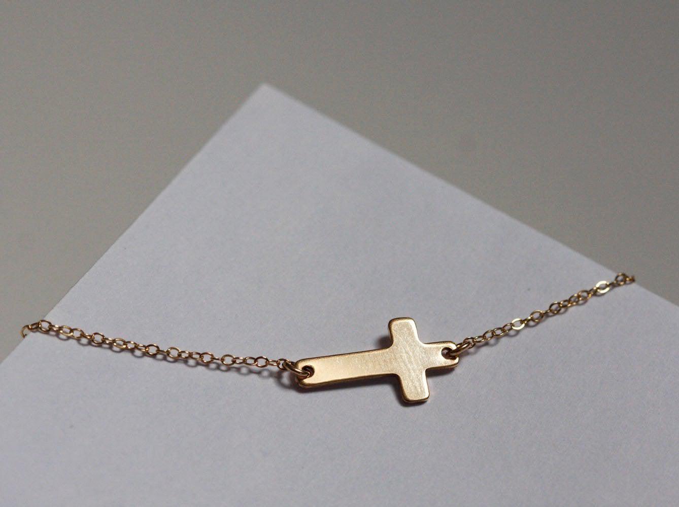 Gold sideways cross necklace