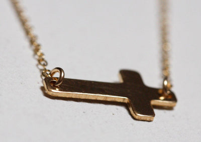 Gold sideways cross necklace