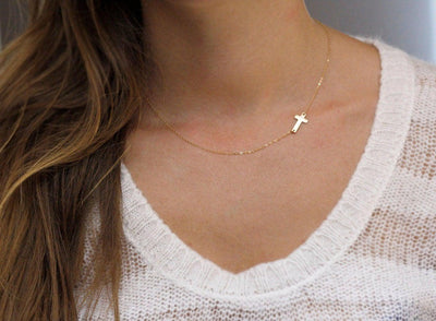 Gold sideways cross necklace