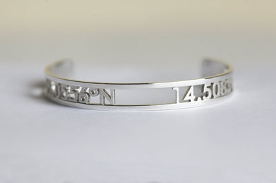 Silver cuff bracelet with personalized coordinates
