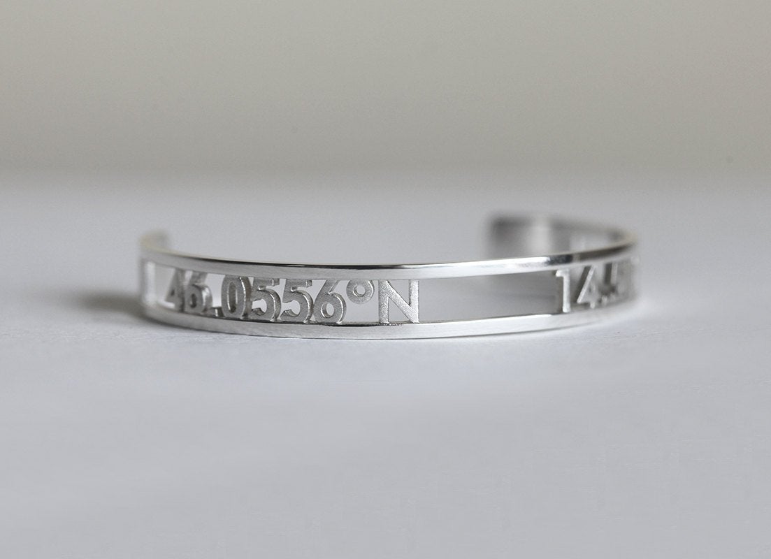 Silver cuff bracelet with personalized coordinates