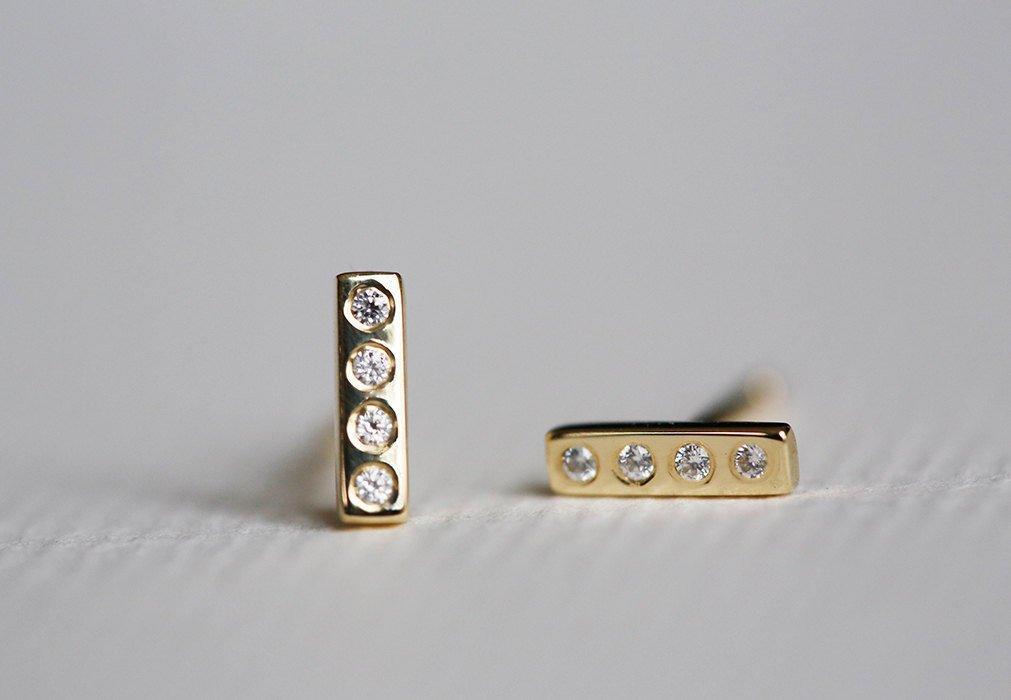 Round white diamond stud gold bar earrings