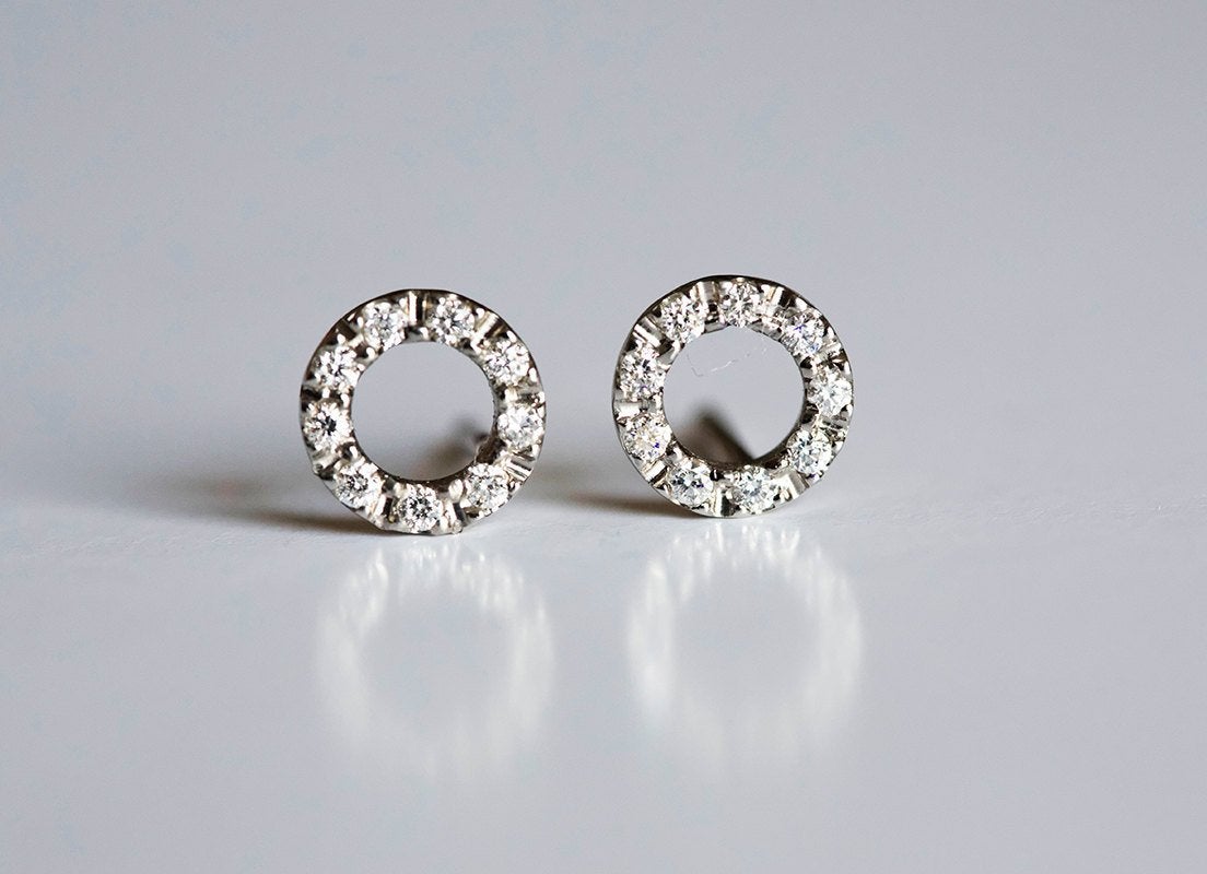 Gold stud earrings with round diamond halo