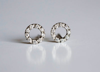 Gold stud earrings with round diamond halo