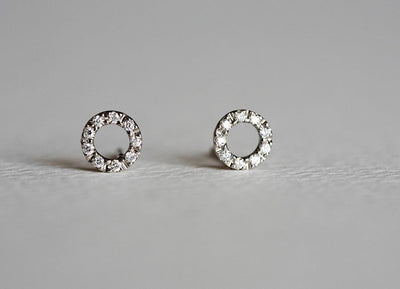 Gold stud earrings with round diamond halo