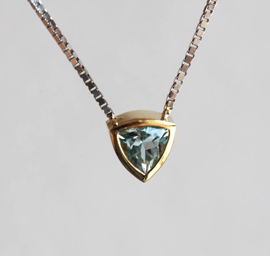 Gold chain necklace with trillion-cut aquamarine stone