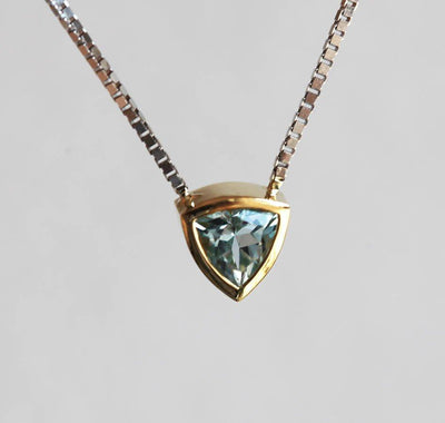 Gold chain necklace with trillion-cut aquamarine stone