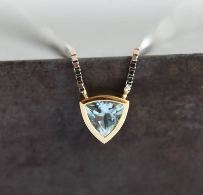 Gold chain necklace with trillion-cut aquamarine stone