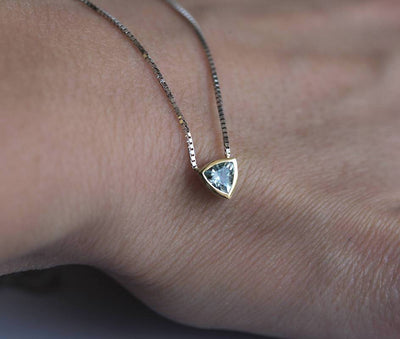Gold chain necklace with trillion-cut aquamarine stone