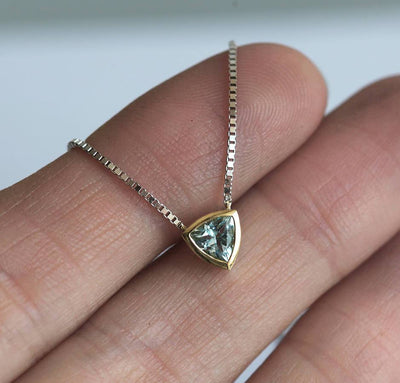 Gold chain necklace with trillion-cut aquamarine stone
