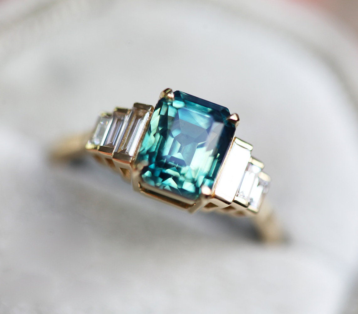 Art-deco radiant-cut blue sapphire ring with white baguette-shaped diamonds