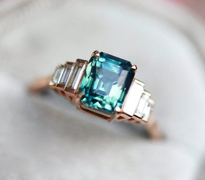 Art-deco radiant-cut blue sapphire ring with white baguette-shaped diamonds