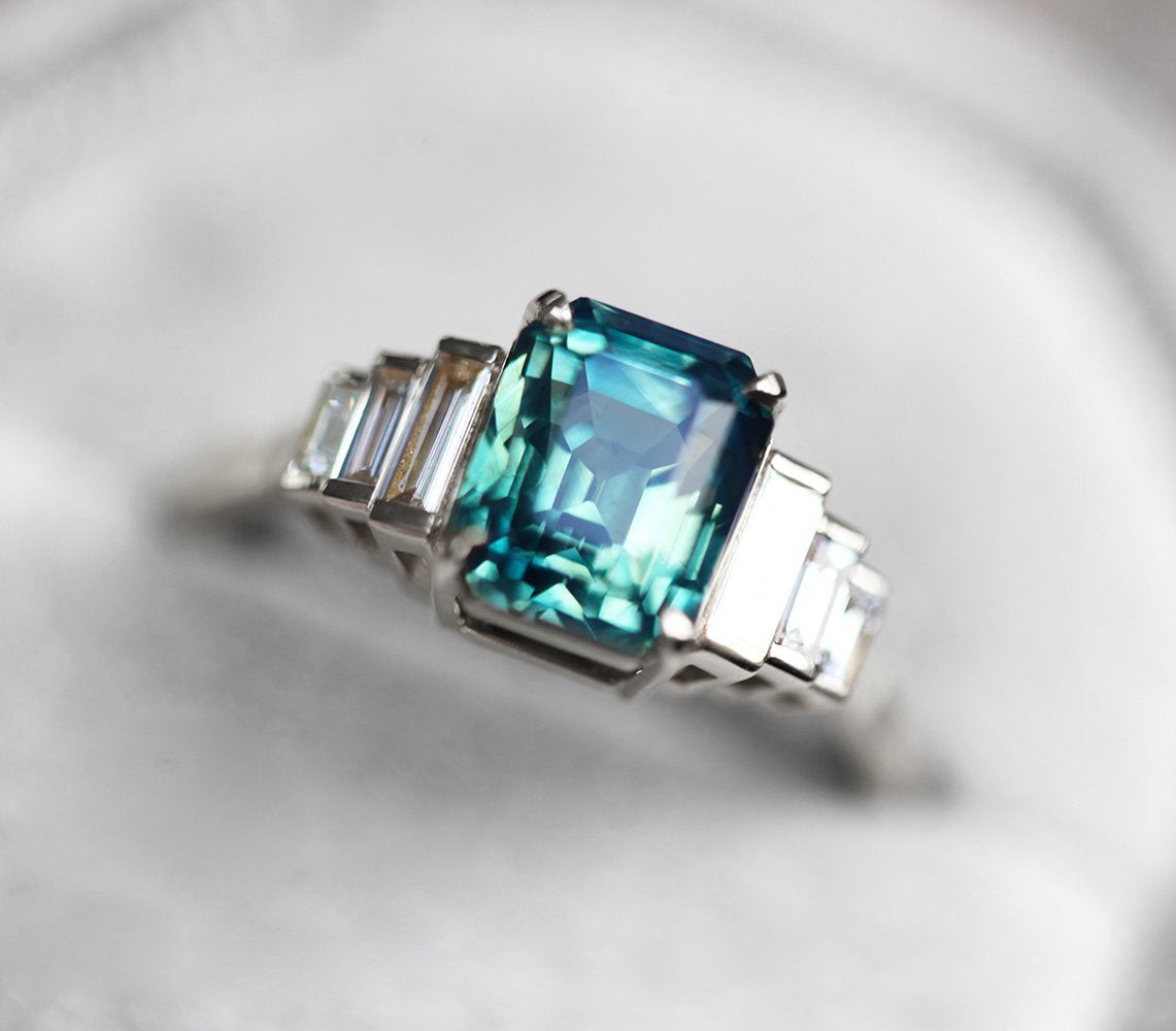 Art-deco radiant-cut blue sapphire ring with white baguette-shaped diamonds