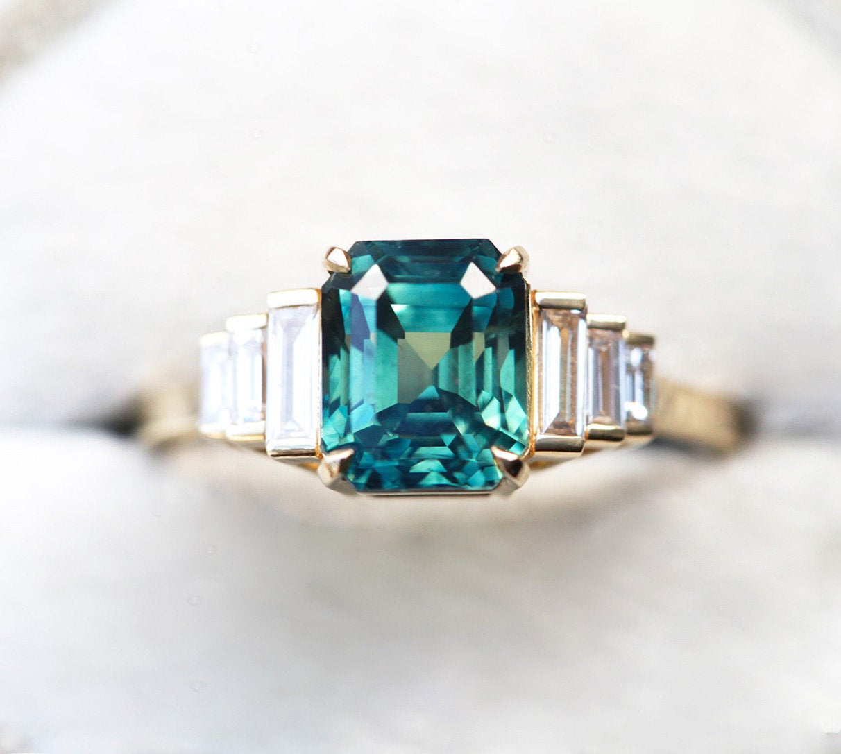 Art-deco radiant-cut blue sapphire ring with white baguette-shaped diamonds