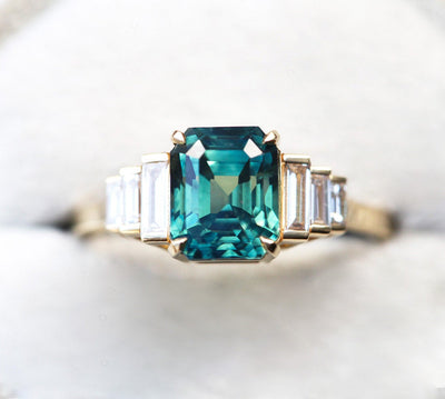 Art-deco radiant-cut blue sapphire ring with white baguette-shaped diamonds