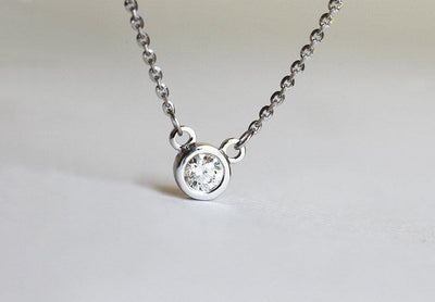 Gold bezel chain necklace with white round diamond