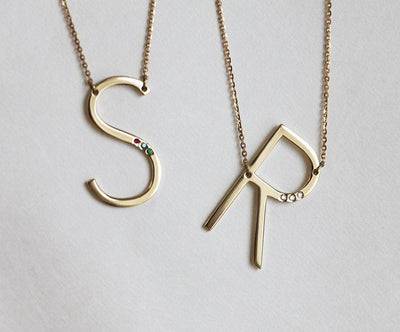 Gold necklace with personalized initial and birthstones