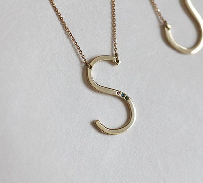 Gold necklace with personalized initial and birthstones