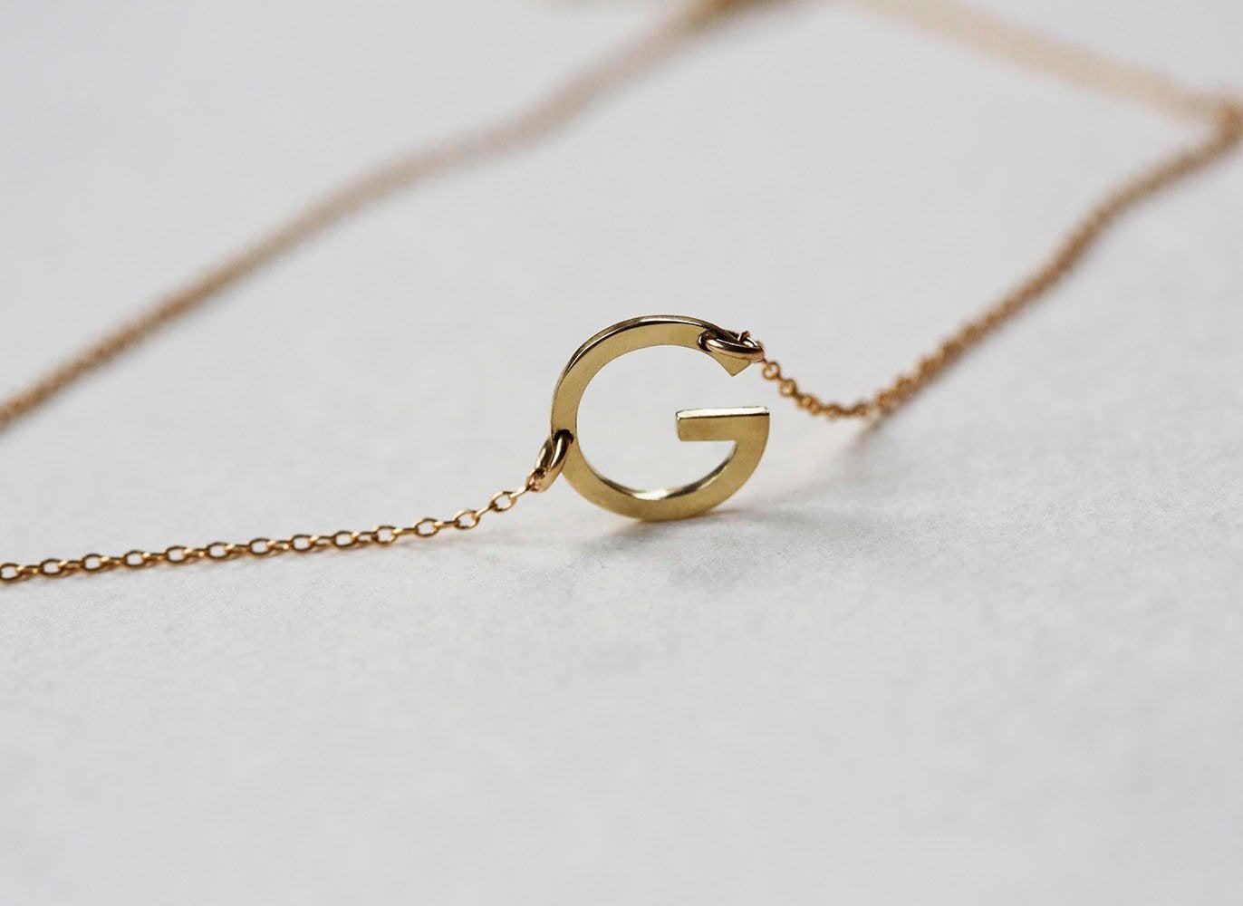 Gold chain necklace with personalized small initial letter
