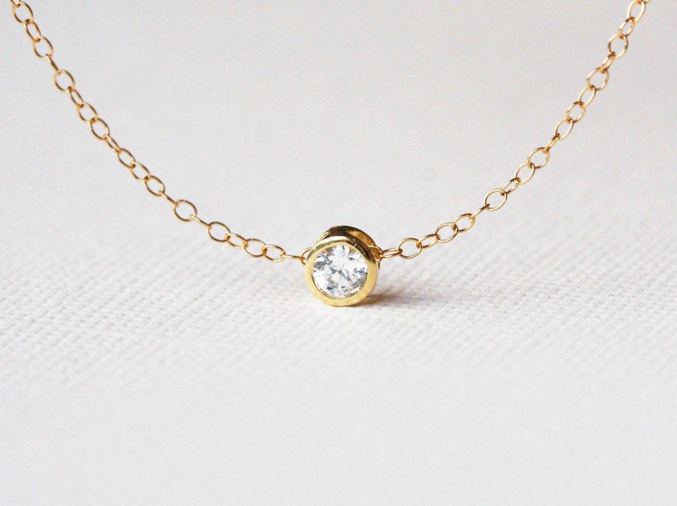 Gold chain necklace with white round diamond