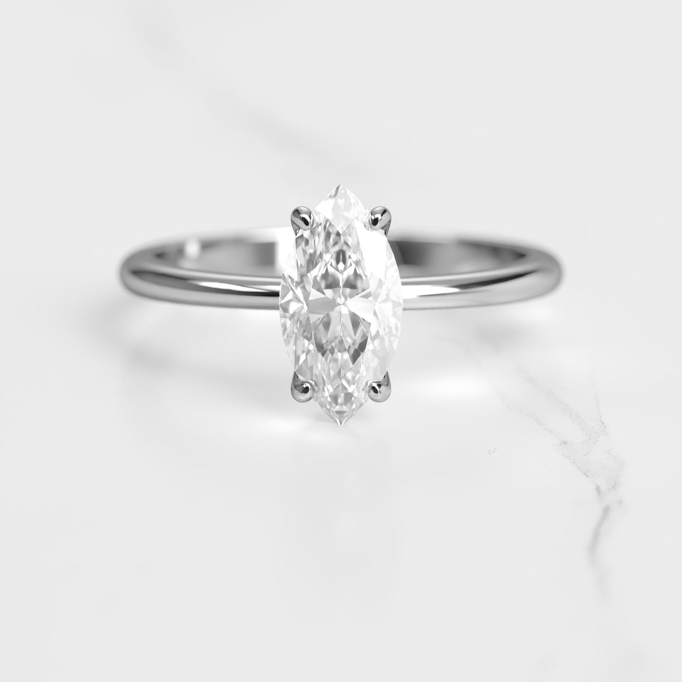 Marquise-cut tapered solitaire moissanite ring