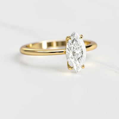 Marquise-cut tapered solitaire moissanite ring