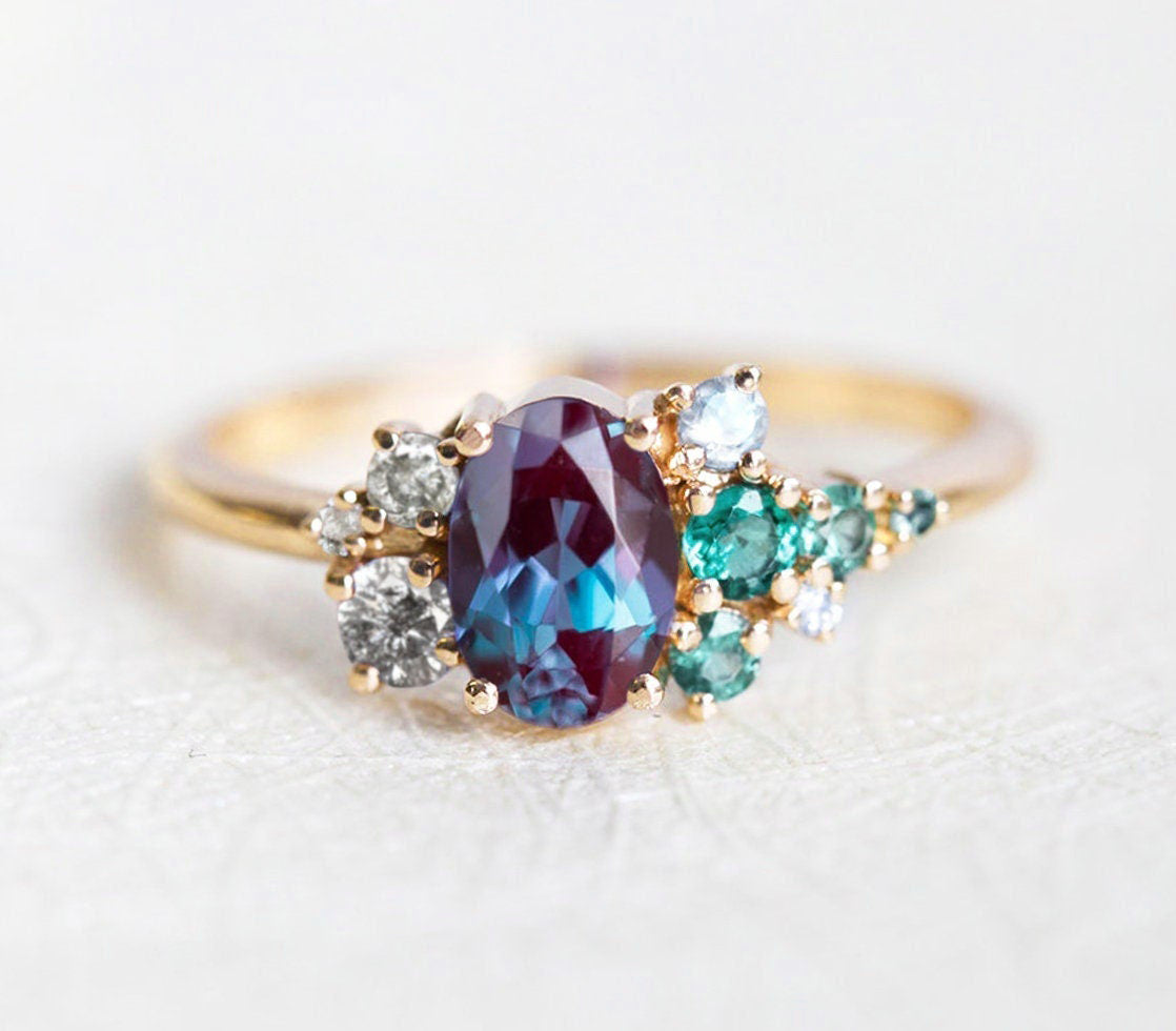 Purple Oval Alexandrite, Yellow Gold Ring with Side White Diamonds, Sapphire and Emerald Stones