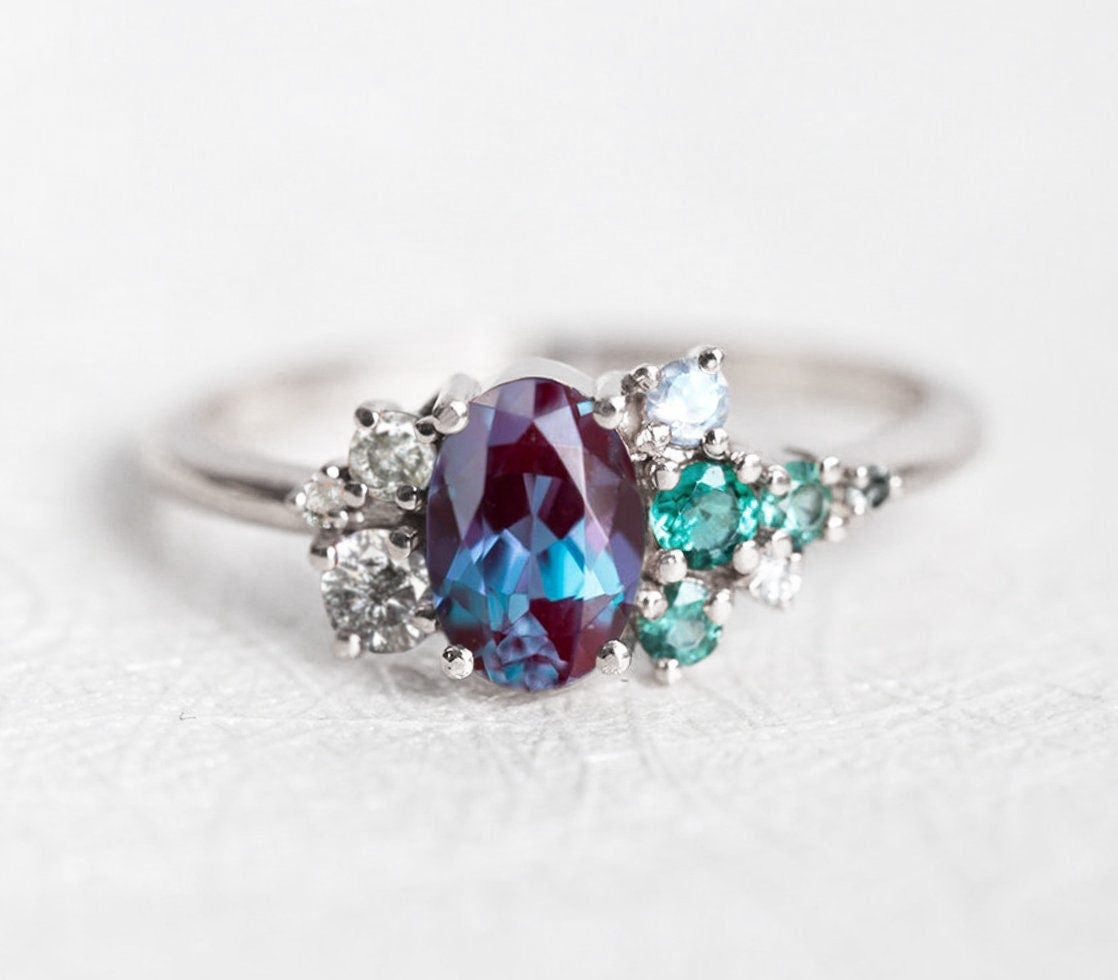 Purple Oval Alexandrite, White Gold Ring with Side White Diamonds, Sapphire and Emerald Stones