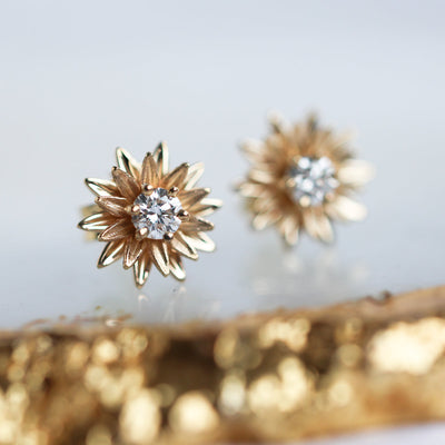 Round diamond and gold sunflower stud earrings