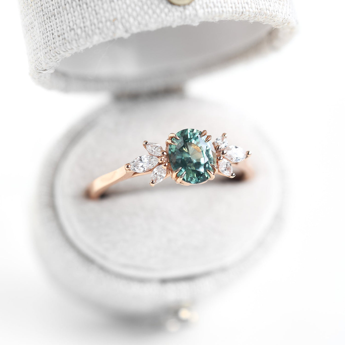 Teal sapphire and diamond ring