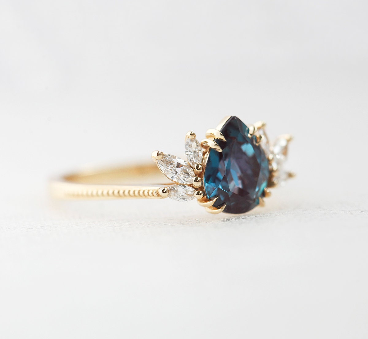 Teal Pear Alexandrite Yellow Gold Ring with Side Marquise-Cut White Diamonds