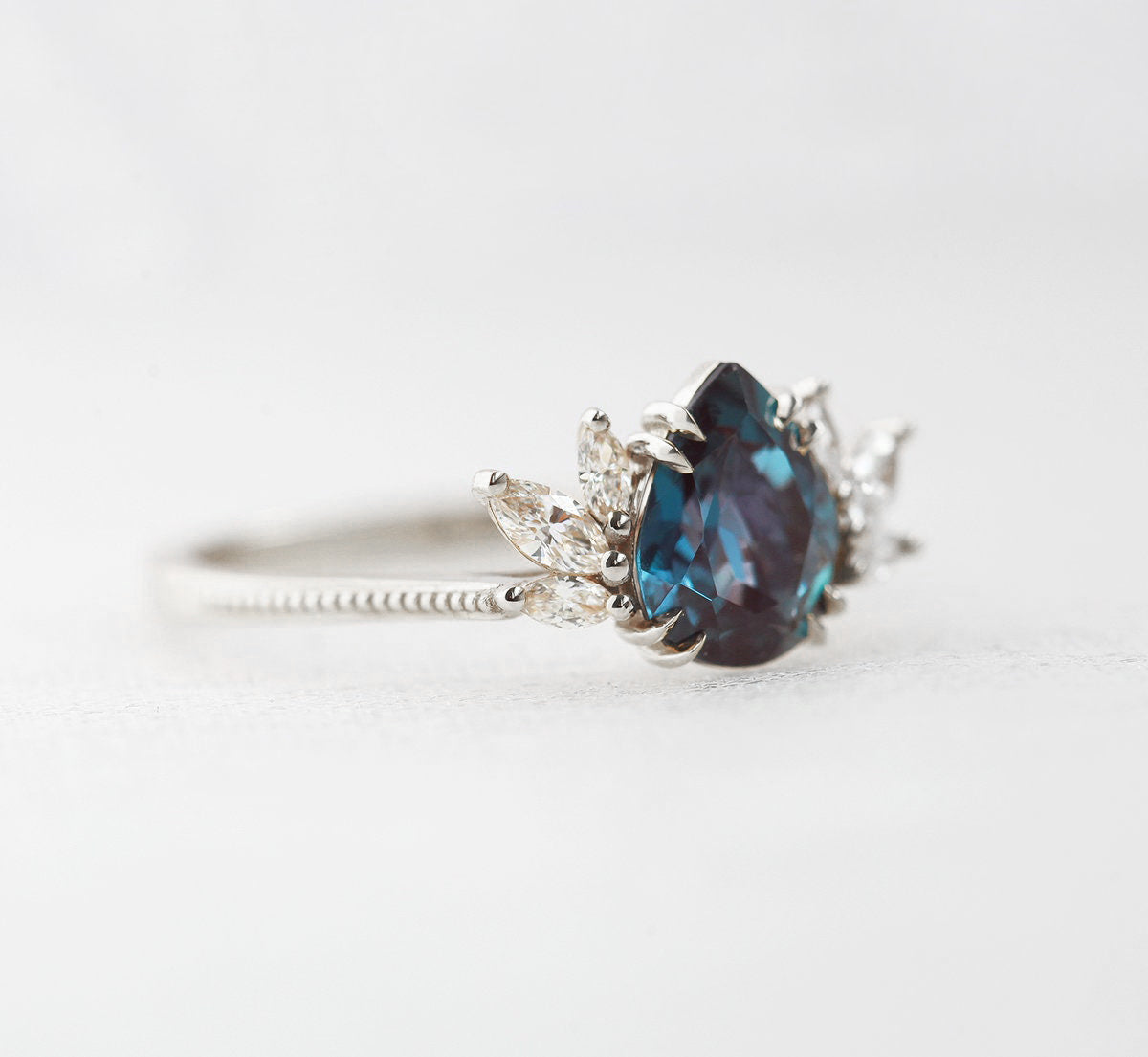 Teal Pear Alexandrite White Gold Ring with Side Marquise-Cut White Diamonds
