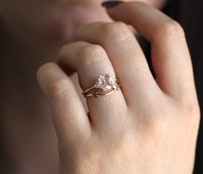 Radiant peach pink sapphire ring with white side diamonds