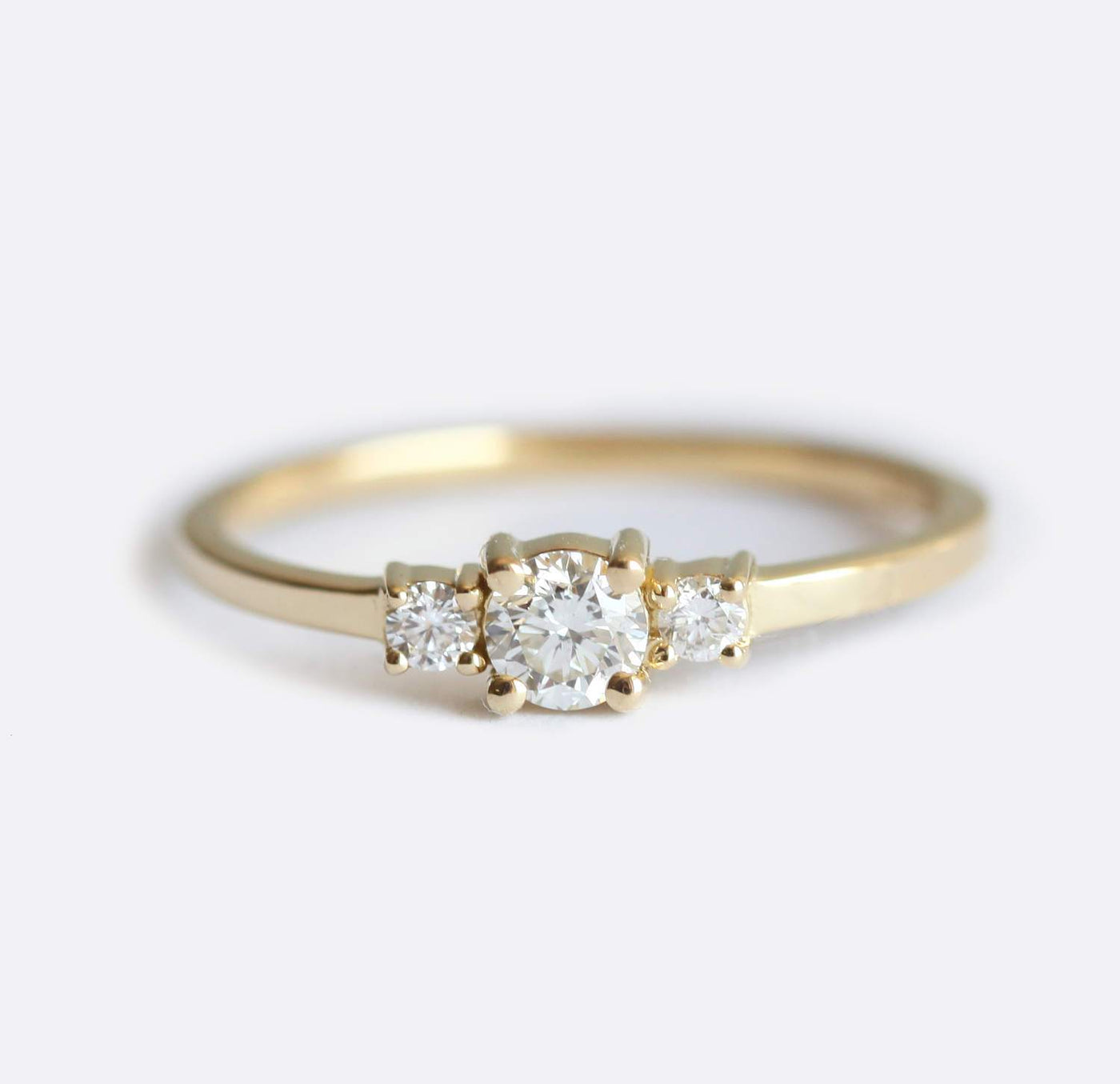 Round white three stone diamond ring