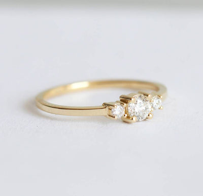 Round white three stone diamond ring