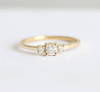 Round white three stone diamond ring