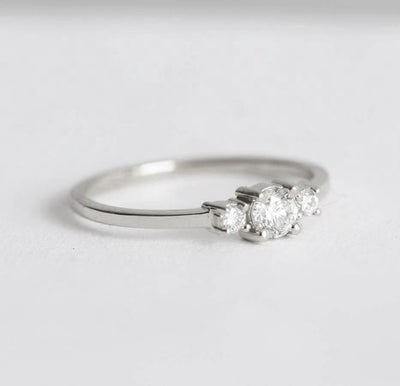 Round white three stone diamond ring