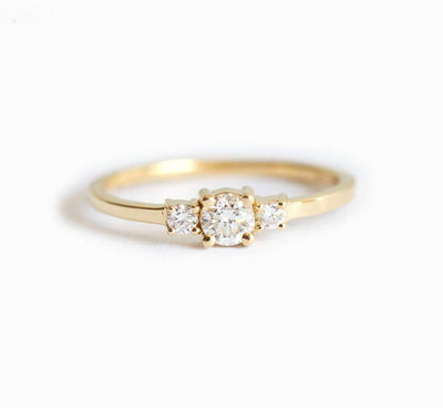 Round white three stone diamond ring