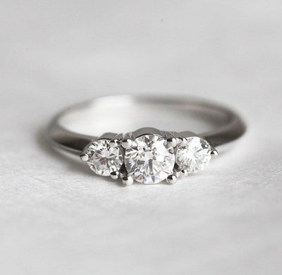 Three stone round white diamond ring