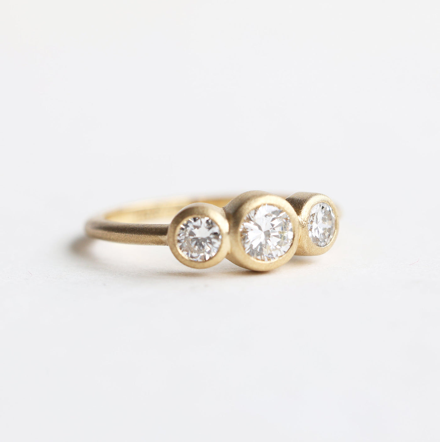 Three diamond ring bezel diamond engagement ring