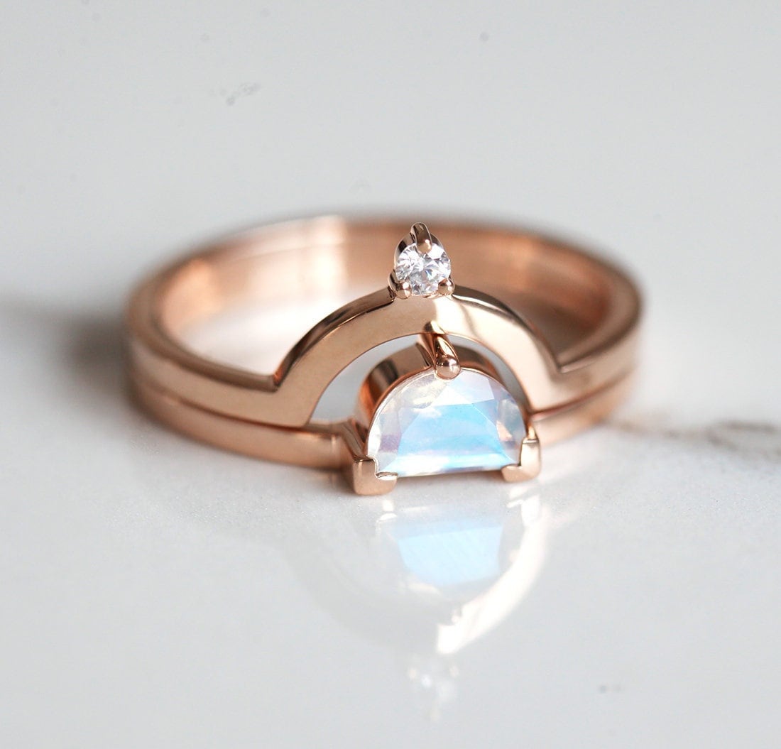 Half-moon-shaped white moonstone and diamond ring set with matching curved band