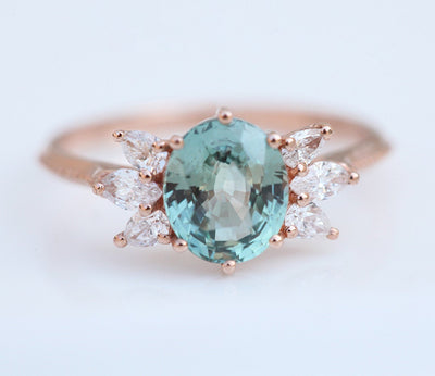 Oval-shaped mint sapphire ring with white diamonds