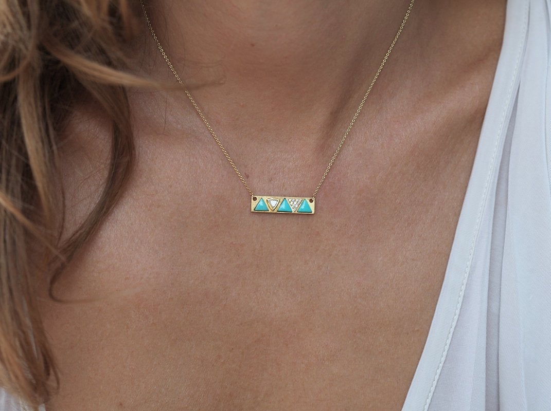 Gold chain necklace with three trillion-cut blue turquoise stones and diamonds