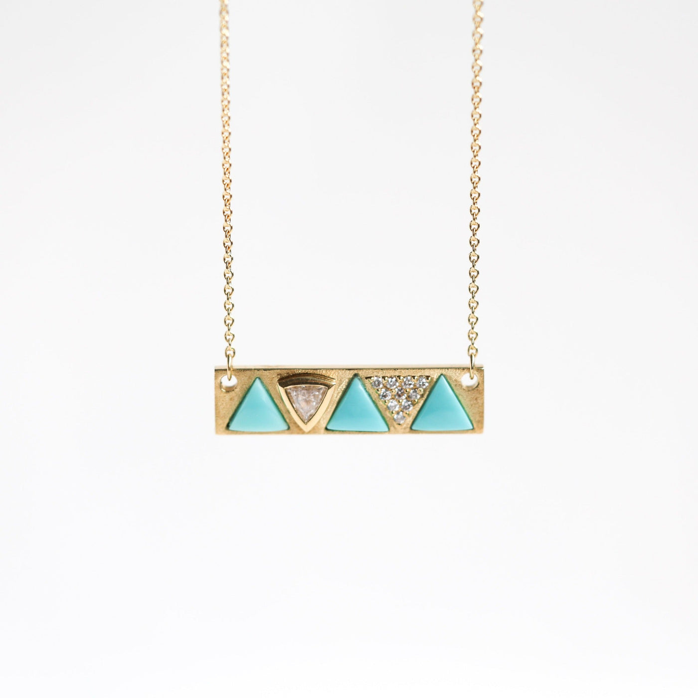 Gold chain necklace with three trillion-cut blue turquoise stones and diamonds