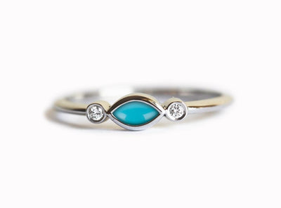 Marquise-cut blue turquoise engagement ring with white side diamonds