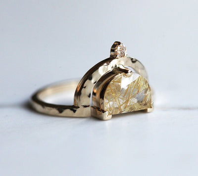 Half-moon-shaped golden rutile quartz ring with champagne diamond