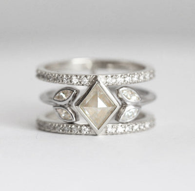 Unique kite and marquise-cut salt and pepper diamond ring with round white diamond pave